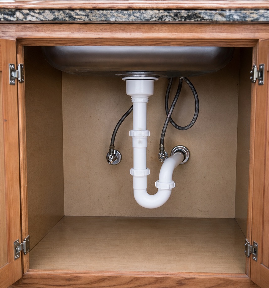After — Leaking under-sink drain → clean new P-trap
